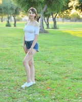 Long-legged amateur babe Tristan poses, strips and masturbates outdoors