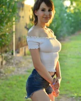 Long-legged amateur babe Tristan poses, strips and masturbates outdoors