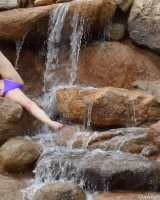 Long-legged amateur babe Tristan poses, strips and masturbates outdoors