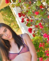 Thin teen Veronica goes nude while modelling by herself near a pool