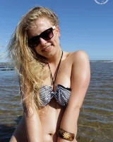 Hairy pussy Gretel in bikini going nude outside in the water to have her nipples puffy