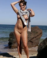 Busty Kendra in the sea in red bikini