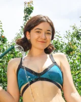 Lily Summers get wet in the garden in sexy bikini and nude showing her hairy vagina and puffy nipples