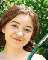 Lily Summers get wet in the garden in sexy bikini and nude showing her hairy vagina and puffy nipples