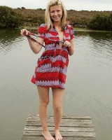 Blonde Melaina in green bikini flashing in the pier