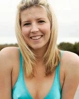 Blonde Melaina in green bikini flashing in the pier