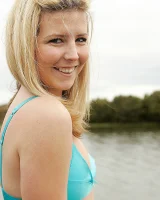 Blonde Melaina in green bikini flashing in the pier