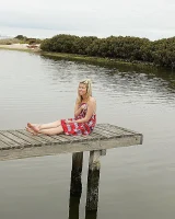 Blonde Melaina in green bikini flashing in the pier