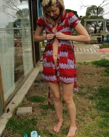 Blonde Melaina in green bikini flashing in the pier