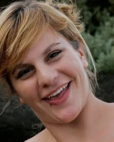 Nora is in the bikini and nude on the beach