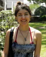 Busty latin baby Adriene Macedo is in the pool in sexy dark red bikini