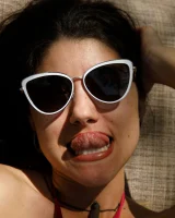 Busty latin baby Adriene Macedo is in the pool in sexy dark red bikini