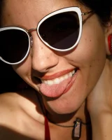 Busty latin baby Adriene Macedo is in the pool in sexy dark red bikini