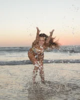 Amazing Anastasia Black is walking on the street and beach in her sexy bikini