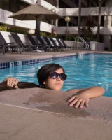 Perfect brunette Caroline Ray in the pool in sexy bikini