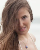 Sexy baby Coco Rose is on the beach in white micro bikini