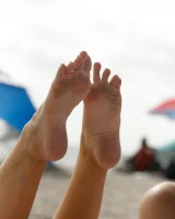 Dubsie Liftoff is on the beach in sexy summer dress, she poses in sexy blue bikini and flashes hairy pussy and erected nipples