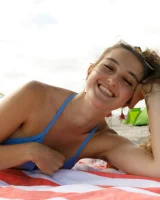 Dubsie Liftoff is on the beach in sexy summer dress, she poses in sexy blue bikini and flashes hairy pussy and erected nipples