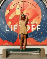 Dubsie Liftoff is on the beach in sexy summer dress, she poses in sexy blue bikini and flashes hairy pussy and erected nipples