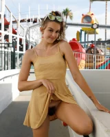 Dubsie Liftoff is on the beach in sexy summer dress, she poses in sexy blue bikini and flashes hairy pussy and erected nipples