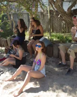 Tits flashing playful busty Elizabeth Marxs has fun on the beach in motley bikini