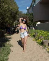 Tits flashing playful busty Elizabeth Marxs has fun on the beach in motley bikini