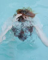 Redhead beauty Emily Archer visiting pool in sexy red and white bikini