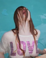 Redhead beauty Emily Archer visiting pool in sexy red and white bikini