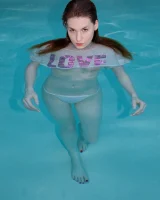 Redhead beauty Emily Archer visiting pool in sexy red and white bikini