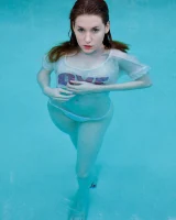 Redhead beauty Emily Archer visiting pool in sexy red and white bikini