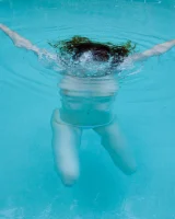 Redhead beauty Emily Archer visiting pool in sexy red and white bikini