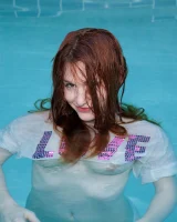 Redhead beauty Emily Archer visiting pool in sexy red and white bikini