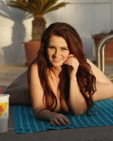 Busty Emmy Sinclair in red bikini is good on the bun