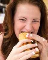 Busty Emmy Sinclair in red bikini is good on the bun