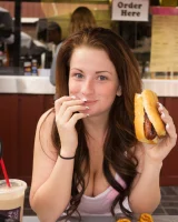 Busty Emmy Sinclair in red bikini is good on the bun