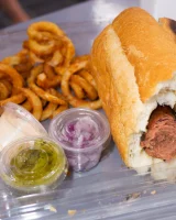 Busty Emmy Sinclair in red bikini is good on the bun