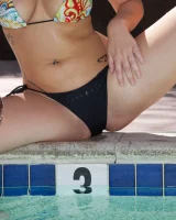 Pool girl Hannah Kinney is sexy in bikini