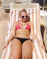 Las Vegas blonde baby Issy Mai caught by the pool in bikini