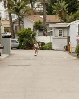 Busty chick Jade Baker is sexy skateboarder in cut tiny jeans shorts and fantastic baby in black bikini on the beach