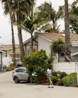Busty chick Jade Baker is sexy skateboarder in cut tiny jeans shorts and fantastic baby in black bikini on the beach