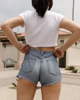 Busty chick Jade Baker is sexy skateboarder in cut tiny jeans shorts and fantastic baby in black bikini on the beach