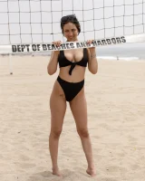 Busty chick Jade Baker is sexy skateboarder in cut tiny jeans shorts and fantastic baby in black bikini on the beach
