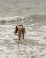 Busty chick Jade Baker is sexy skateboarder in cut tiny jeans shorts and fantastic baby in black bikini on the beach