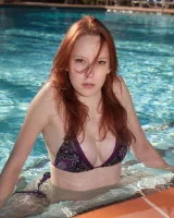 Sexy girl Kimmy Diedrick makes sexy bikini poses in the pool