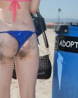 Sweet brunette Natalie Moore is sexy in the sea and on the beach wearing blue and pink bikini