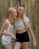 Two young sexy blonde hotties Rune Kimele and Bernie Svintis are walking in the city and changing in bikini in the forest