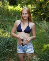 Two young sexy blonde hotties Rune Kimele and Bernie Svintis are walking in the city and changing in bikini in the forest
