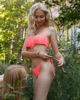 Two young sexy blonde hotties Rune Kimele and Bernie Svintis are walking in the city and changing in bikini in the forest