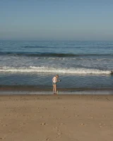 Amateur babe Sloan Kendricks enjoys a day on the beach modeling her swimsuits