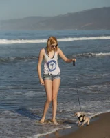 Amateur babe Sloan Kendricks enjoys a day on the beach modeling her swimsuits